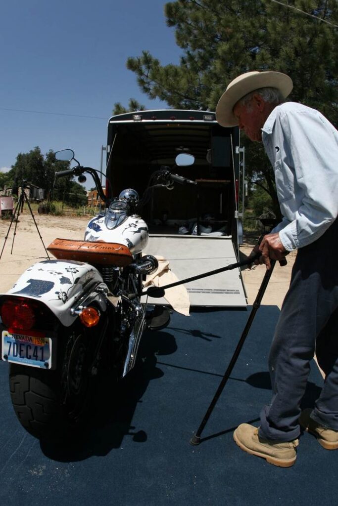 John Finn giving the tribute motorcycle a full inspection