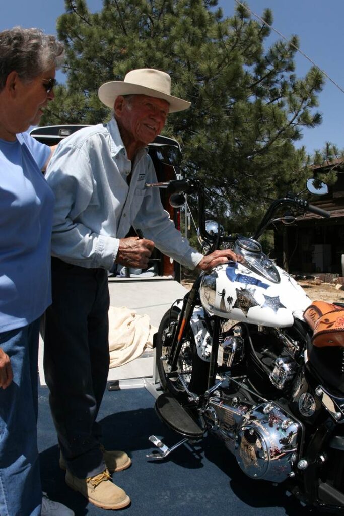 John Finn agreeing to sign the gas tank of Metal of Honor