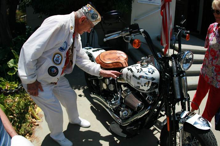 Stu Hedley, President of the Pearl Harbor Survivors Association Carnation Chapter 3, inspecting the finished bike
