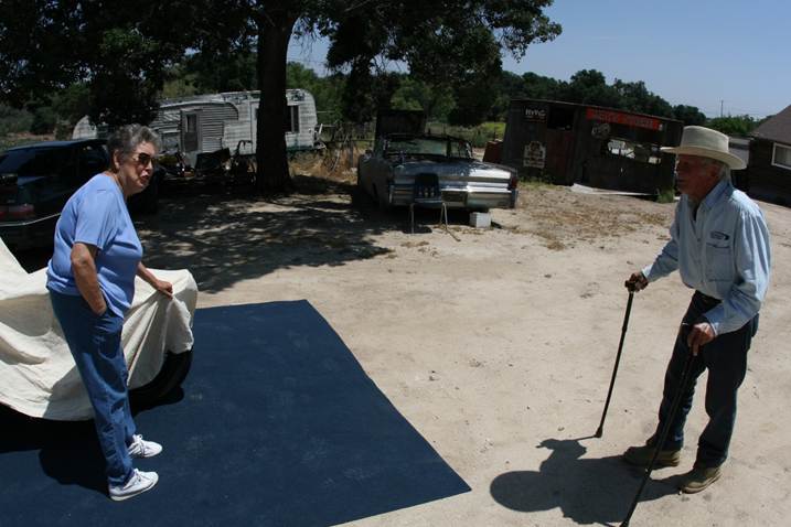 Frances Carmichael, John Finn’s longtime caretaker, pulling the cover off Metal of Honor