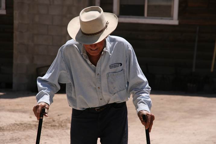 John Finn, two months shy of his 100th birthday, walking from his house to see the bike