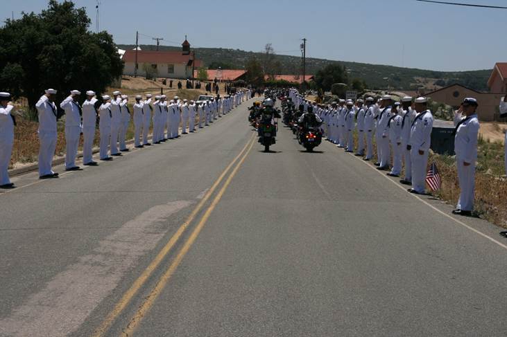 US Navy personnel lining the approach to John Finn’s burial site to render honors