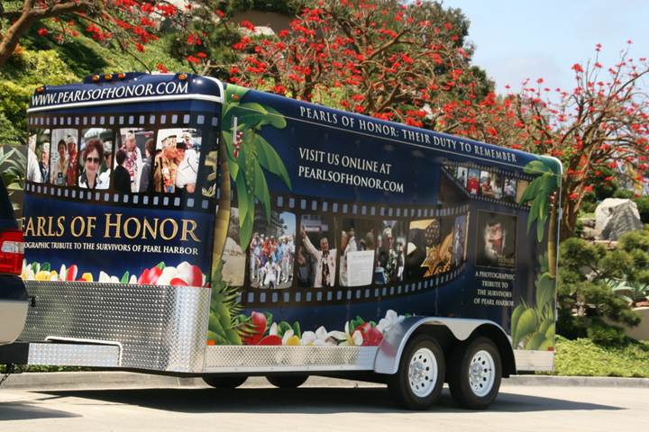 Side of the trailer wrapped to look like a roll of film, with Pearl Harbor Survivor portraits in each frame
