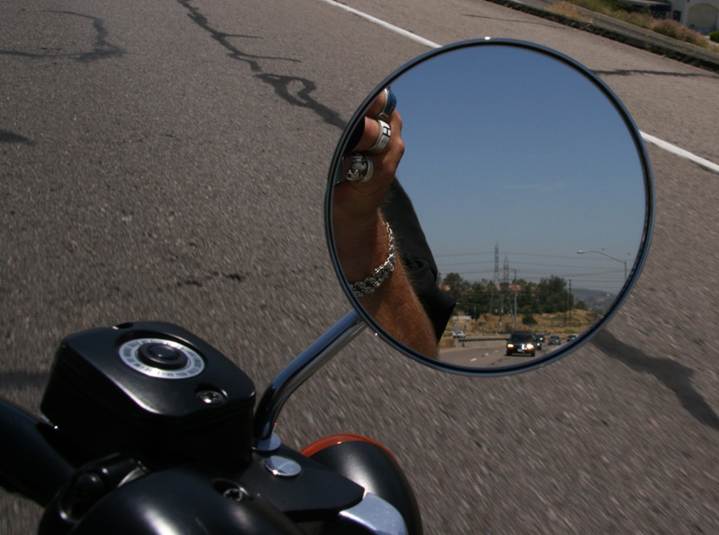 John Finn’s hearse seen in the rear view mirror of Metal of Honor on the interstate