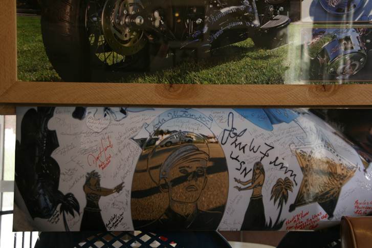 Enlarged photo of the Metal of Honor gas tank covered in signatures from John Finn’s family, friends and fans